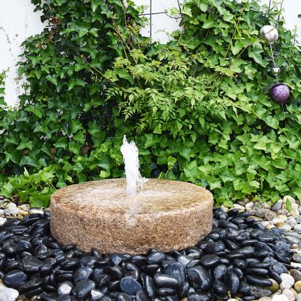 Mühlstein Springbrunnen